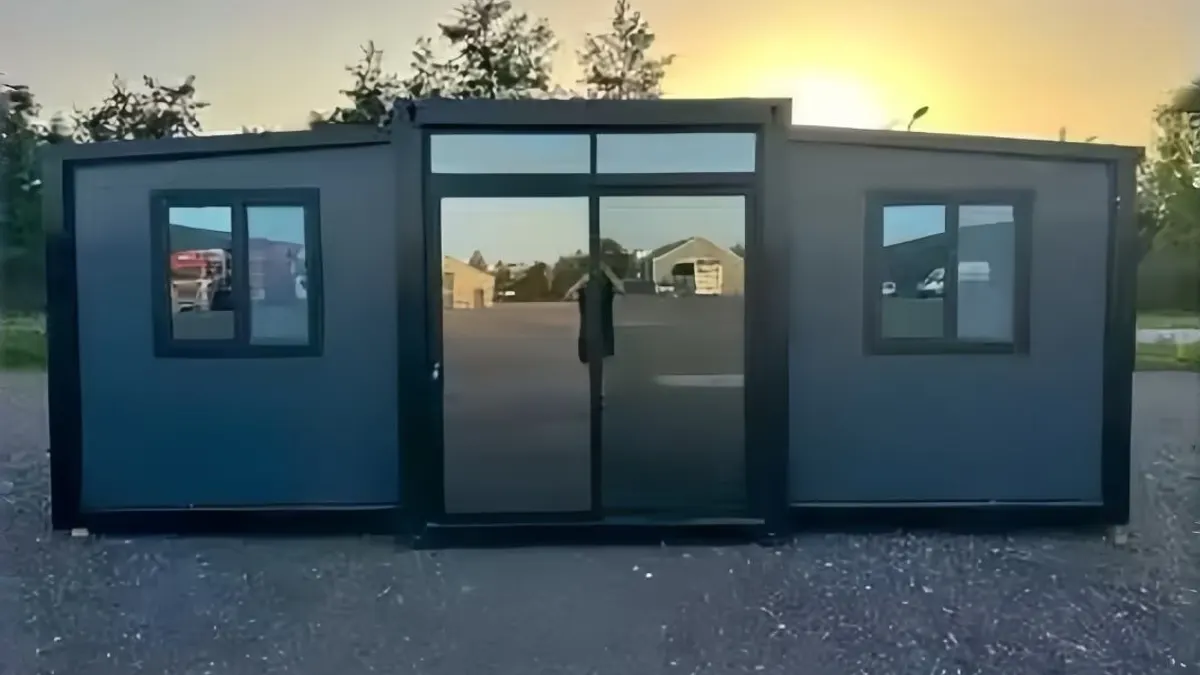 Expandable cabin with glass frontage at sunset for late-arrival guest-flow planning