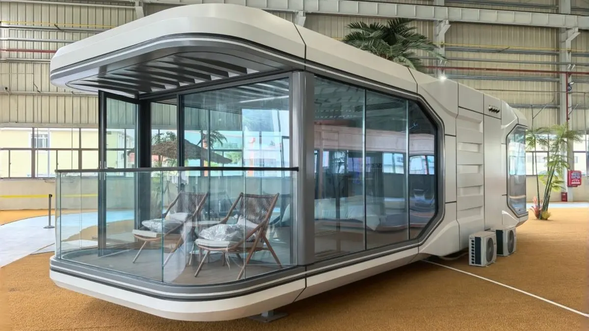 Long panoramic capsule module in a landscaped resort setting for back-of-house planning