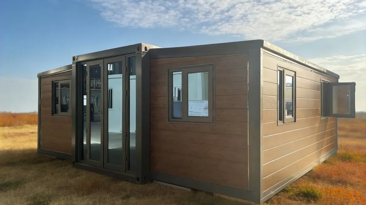 Wood-finished expandable cabin on a prepared site for resort support planning