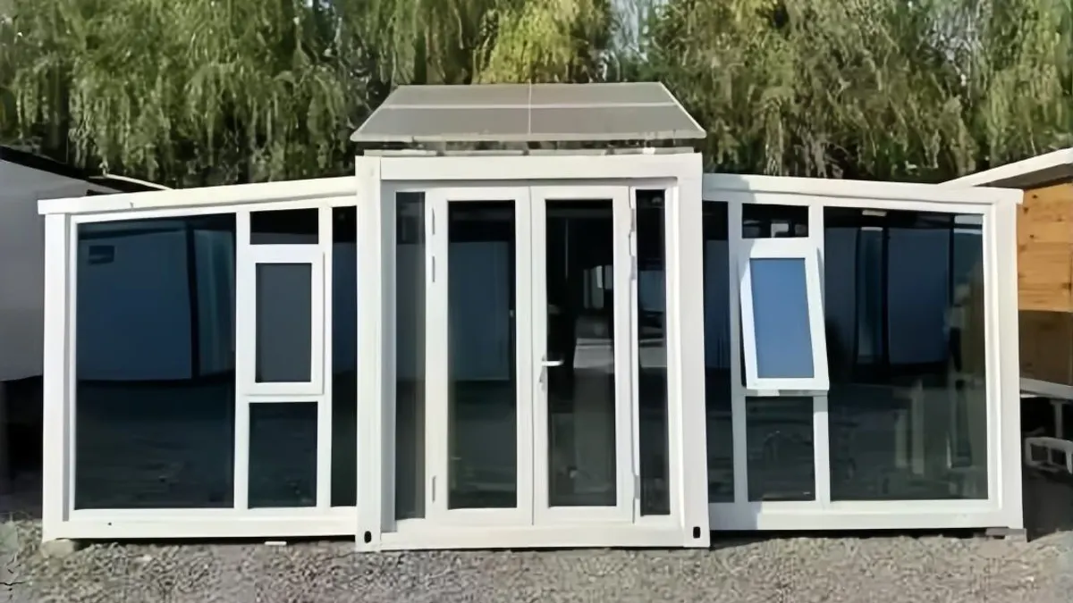 Glass-front expandable cabin in a landscaped setting for hotel-room pipeline planning
